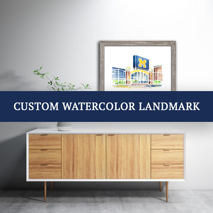 Framed watercolor of Michigan Stadium, advertising custom orders for watercolor projects.