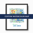 Black frame with watercolor map with text advertising custom watercolor map projects.