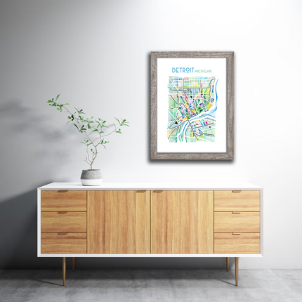 Framed watercolor print of a map of Detroit, Michigan in vibrant color, created by Emily Frushour.