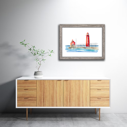 Framed watercolor of bright red Grand Haven Lighthouse an pier in Michigan.