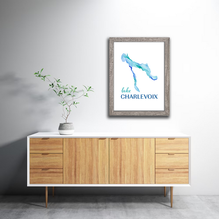 Framed watercolor painting of Lake Charlevoix in Michigan, in vibrant blues.