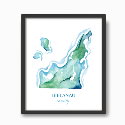 Black frame with a watercolor map of Leelanau County in blues and greens, created by Emily Frushour.
