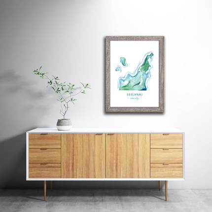 Framed watercolor map of Leelanau County, Michigan, in rich blues and greens.