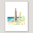 Watercolor painting of Little Sable Point Lighthouse on Lake Michigan, surrounded by sand dunes and grass.