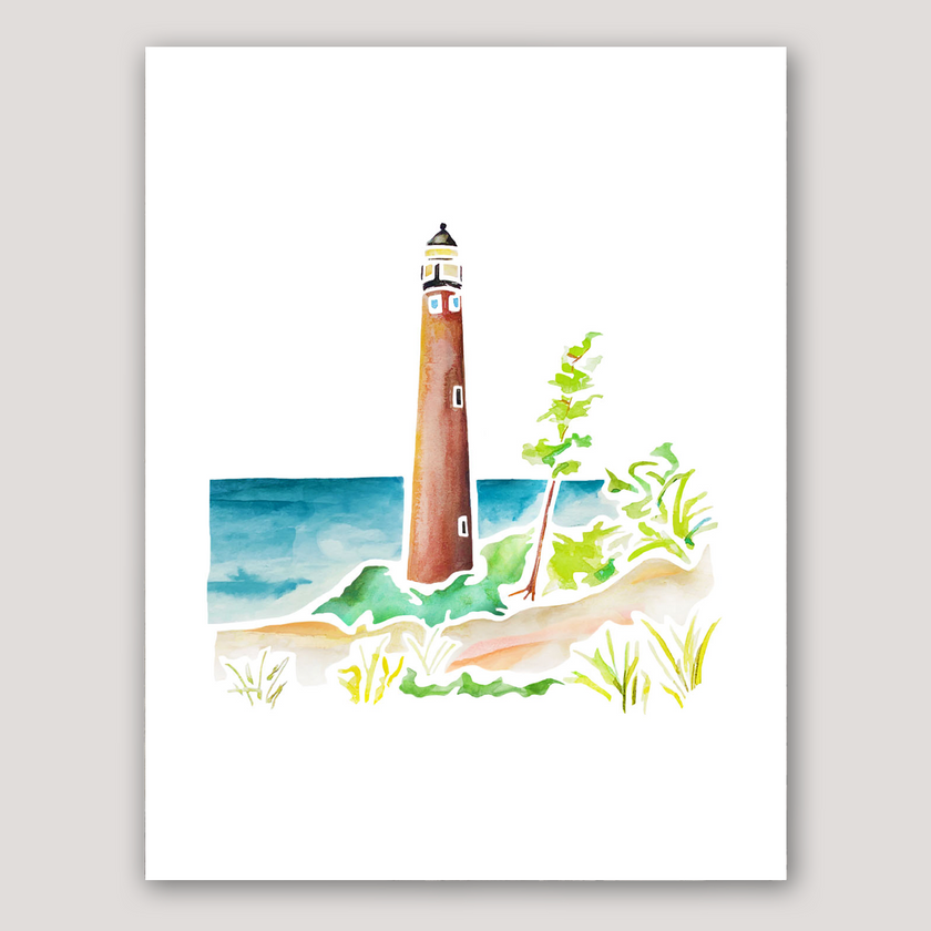 Watercolor painting of Little Sable Point Lighthouse on Lake Michigan, surrounded by sand dunes and grass.