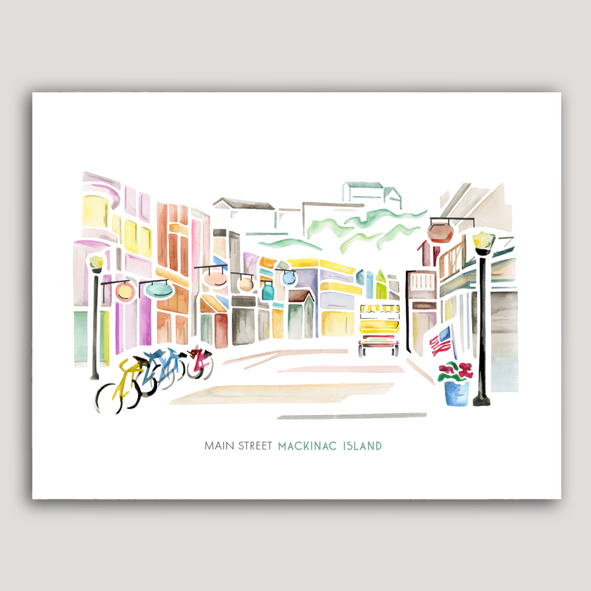 Fun and colorful watercolor scene from Main Street on Mackinac Island, with shops, bikes and a horse-drawn carriage.