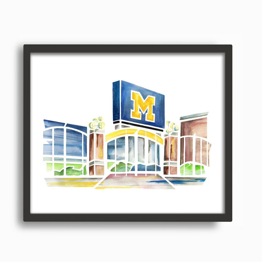 Bright watercolor painting of Michigan Stadium including M sign and entrance gate, placed in a simple black frame.