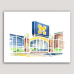 Bright watercolor painting of Michigan Stadium including M sign and entrance gate.