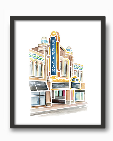 Colorful watercolor painting of he Michigan theater and marquee in Ann Arbor, Michigan. Shades of blue, brown, and gold. Placed in a simple black frame.