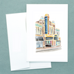 Folded notecard with a watercolor painting of the Michigan Theater in Ann Arbor, created by Emily Frushour.