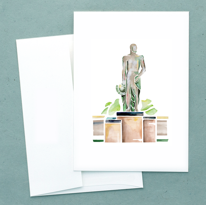 Folded white notecard with watercolor of spartan statue in bronze and green, with envelope.