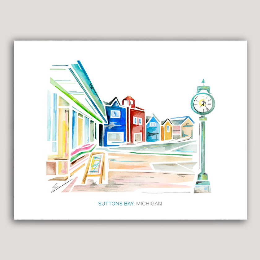 Bright and colorful watercolor painting of a street scene in Suttons Bay, Michigan, showing shops and a clock tower.