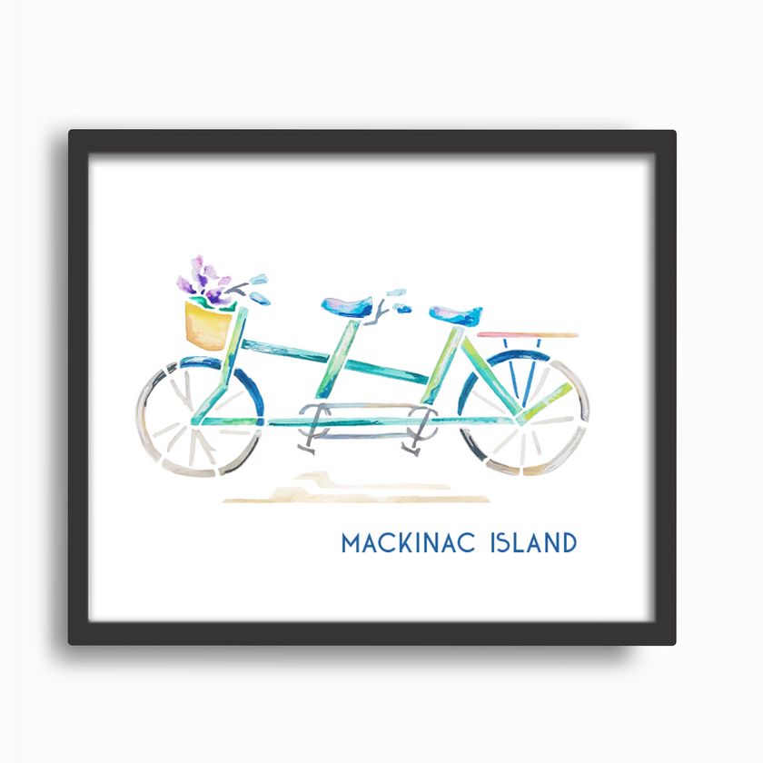 Colorful watercolor print of a green and blue tandem bike with the words Mackinac Island, in a black frame.
