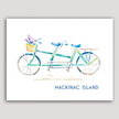 Colorful watercolor print of a green and blue tandem bike with the words Mackinac Island.