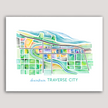 Bright and colorful watercolor painting showing a map of Traverse City, Michigan, in vibrant greens and blues.